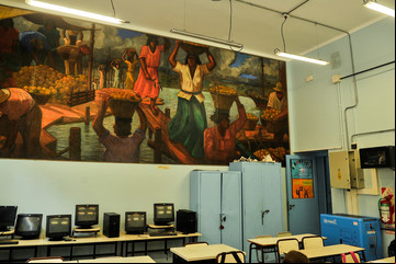 La escuela-museo que donó Quinquela Martín y que hoy recupera el color de sus murales